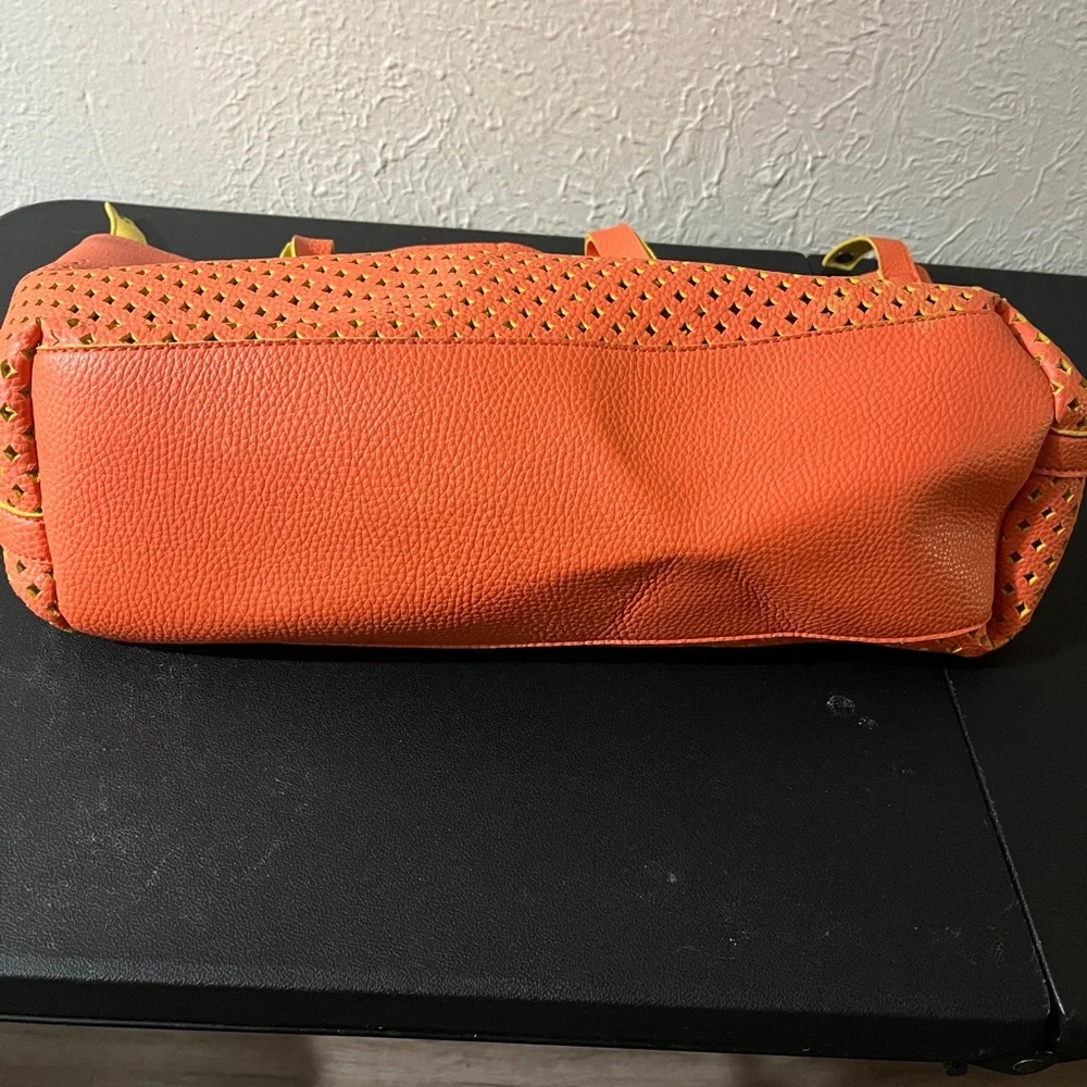 Guess Convertible Hobo Bag in‎ coral and yellow.